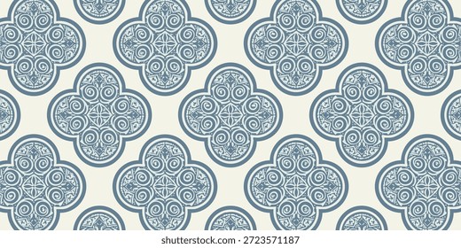 Patrón floral azul adornado sobre un fondo crema visto directamente desde arriba