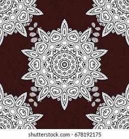 Ornate, eastern mandala with colored contour. Art, round, colorful ornament on a brown background.