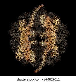 Ornate golden lizard decorated ethnic ornaments and sumptuous patterns with a mandala and silver waves on a black background. For tattoo, embossing, printing on fabric, design of T-shirts