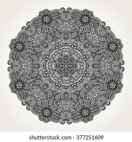 Ornate lacy doodle floral round rosette in black over white backgrounds. Hand drawn mandala. Coloring pages for adults.
