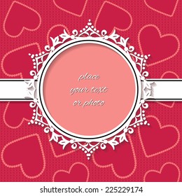 Ornate paper cut frame on romantic background with hearts in deep red colors.