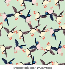 Ornithology seamless pattern with random creative puffin bird ornament. Light blue background. Simple design. Flat vector print for textile, fabric, gift wrap, wallpapers. Endless illustration.