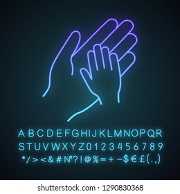 Orphan neon light icon. Adoption. Parent and child hands together. Child rights protection. Charity for children. Orphanage. Glowing sign with alphabet, numbers, symbols. Vector isolated illustration