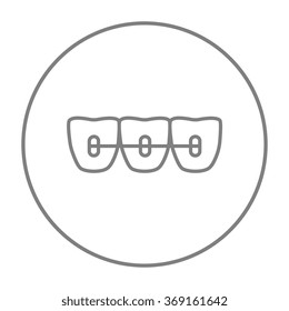 Orthodontic braces line icon.