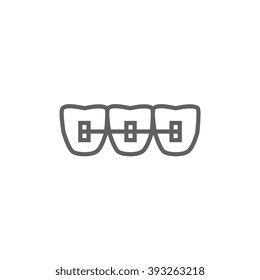 Orthodontic braces line icon.
