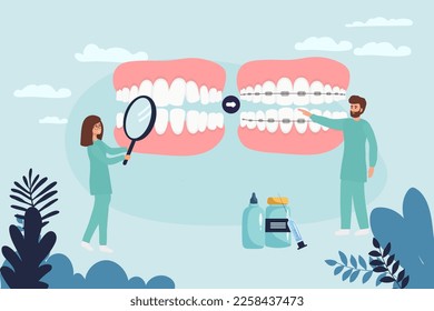 Orthodontist installs dental braces for straightening. Tiny Dentist doctor research X-ray picture of tooth. Dentistry, braces installation, teeth alignment. Prosthetics, Orthodontic treatment