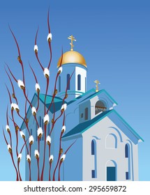 Orthodox church against the blue sky and willow branches with buds