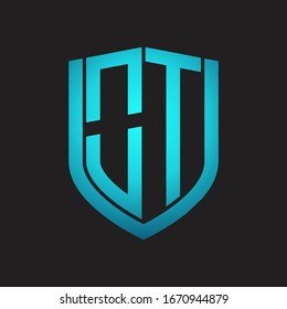 OT Logo monogram with emblem shield design isolated with blue colors on black background