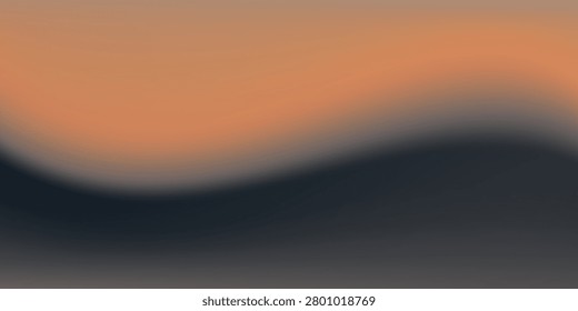 Out of focus sun setting over the ocean glowing orange with dark blue background