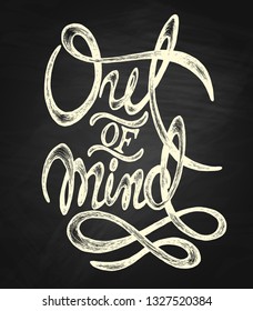 Out of mind - hand drawn quote, white on the blackboard background