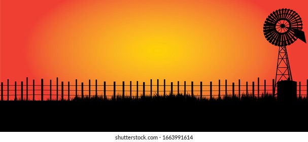 Outback Australia With Black Fence And Old Windmill