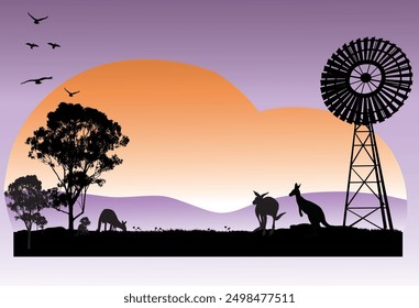 Outback Australia silhouette scene of kangaroos feeding in the sunset and windmill