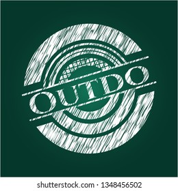 Outdo chalkboard emblem written on a blackboard