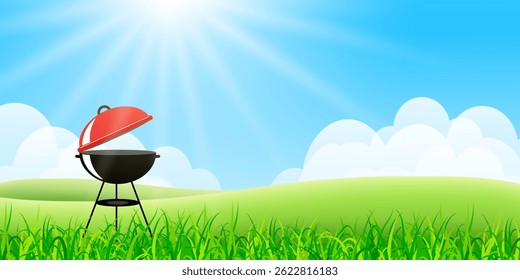 Outdoor barbecue grill with open red lid standing in a green field under a bright sunny sky