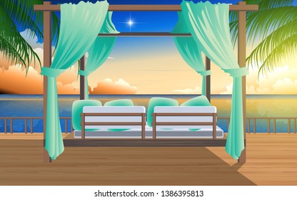 Outdoor cabana bed on the wooden floor in resort at the beach in sunset