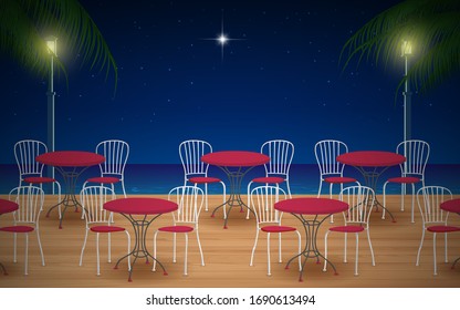 cafetería al aire libre en la playa por la noche