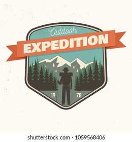 Outdoor expedition patch. Vector illustration. Concept for shirt or print, stamp. Design with hiker on the mountains. Outdoor adventure.