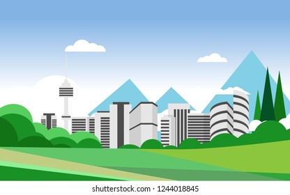 Outdoor landscape natural view of green grass field in summer time with background of big city with mountain range