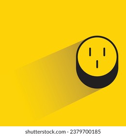 outlet plug with shadow on yellow background