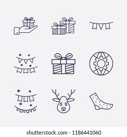 Outline 9 winter icon set. deer, gift, hand with gift box, sock, garlands and globe setting vector illustration