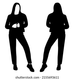 The outline of a black and white silhouette of a slender stylish girl in a fashionable suit standing. Adult model.