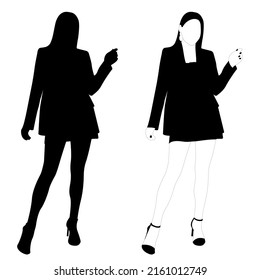 The outline of a black and white silhouette of a slender stylish girl in a fashionable suit standing. Adult model.