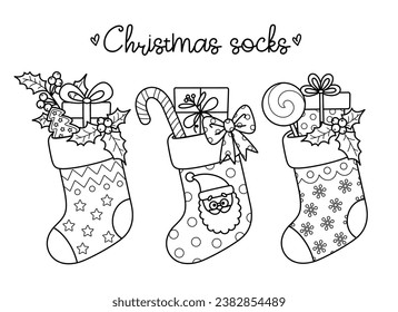 Outline cartoon Christmas winter socks for holiday design. Traditional Xmas stockings with gift boxes, candy, gingerbread, mistletoe. Vector contour illustrations perfect for New Year coloring page.