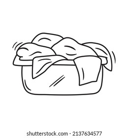 Outline doodle icon of dirty laundry. Hand drawn pile of clothes vector illustration. Textile heap isolated on white.