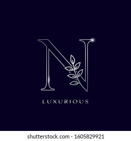 Outline Nature Leaves Initial Letter N logo icon. Silver vector design concept  isolation on blue background color for luxuries business.