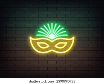 Outline neon carnival mask icon, yellow green. Glowing neon Carnival mask sign with feathers on brick wall. Festival costume and face decoration. Face mask for Brazil carnival, Mardi Gras. Vector icon