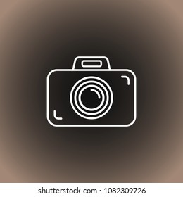 Outline photo camera icon on black/dark gray and beige gradient background. Vector illustration, EPS10.