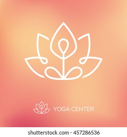 Outline yoga logo with abstract symbol of man in lotus pose on bright blurred background