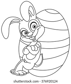 Outlined happy bunny leaned against a big Easter egg. Vector illustration coloring page.