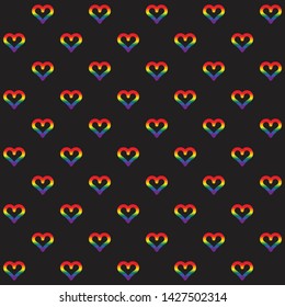 Outlined hearts pattern on black background. 6 official LGBT rainbow colors. Modern print for gay pride poster, wallpaper, sticker template. Colorful postcard. Simple flat design. Symbol of love, joy.