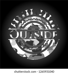 Outside on grey camo texture