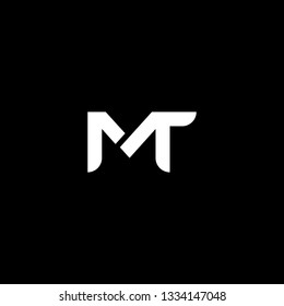 Outstanding professional elegant trendy awesome artistic black and white color MT TM initial based Alphabet icon logo.