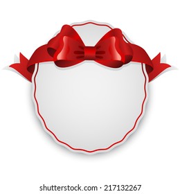 Oval blank white label with red bow.