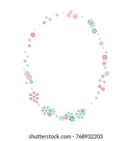Oval Christmas border or frame with random scatter falling red and green snowflakes isolated on white.