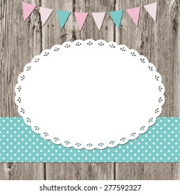 Oval doily frame on old wooden background. Country style. Scrapbook design elements.