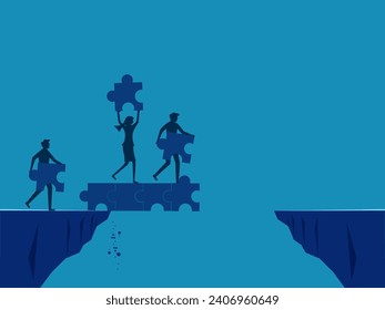 Overcoming business obstacles. Businessmen working as a team connecting jigsaw bridges across cliffs