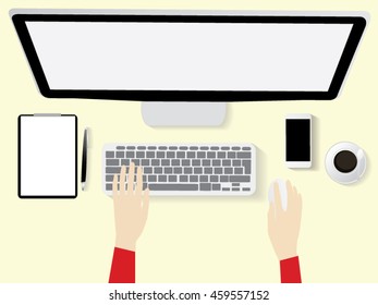 Overhead View Of Businesswoman Working At Computer In Office