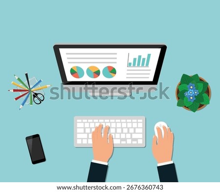 Overhead View of Desktop Computer with Hands Using Keyboard and Mouse Analyzing Charts on Blue Background