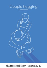 Overhead view of hugging couple