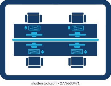Overhead view of a modern office desk setup with four computer workstations in a collaborative arrangement