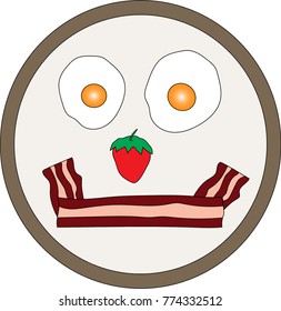 Overhead view of a smile made from breakfast bacon, strawberry, and two eggs on a plate.  