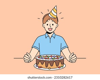 Overjoyed boy child sit at table with birthday hat on head and chocolate cake for special occasion. Smiling kid celebrate anniversary with sweet dessert. Vector illustration. 