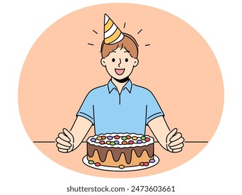 Overjoyed boy child sit at table with birthday hat on head and chocolate cake for special occasion. Smiling kid celebrate anniversary with sweet dessert. Vector illustration.