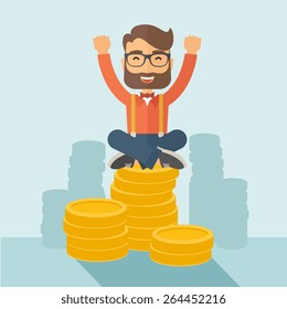 An overjoyed young hipster Caucasian man with beard sitting on the top of  coins. Happily raising his two hands to show that he is a winner. Happy, winner concept. A contemporary style with pastel