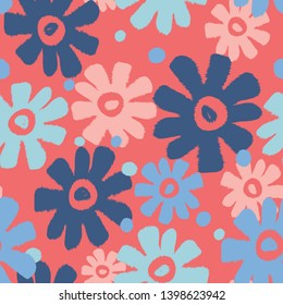 Overlapping flower shapes seamless pattern on a coral background with shades of blue and light pink. 1960's feel but modern color palette. Great for spring and summer textiles, decor and fashion.