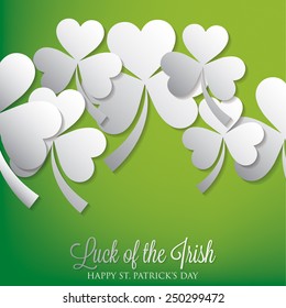 Overlapping shamrock St Patrick's Day card in vector format.